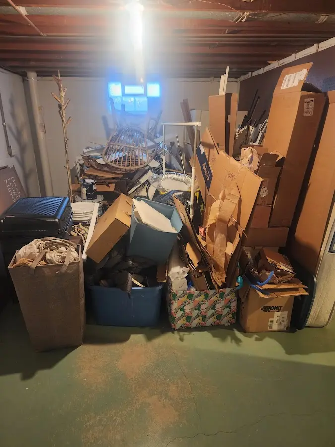 Roll-off dumpster container at job site for 2 Yard Dumpster Rental in Dickinson